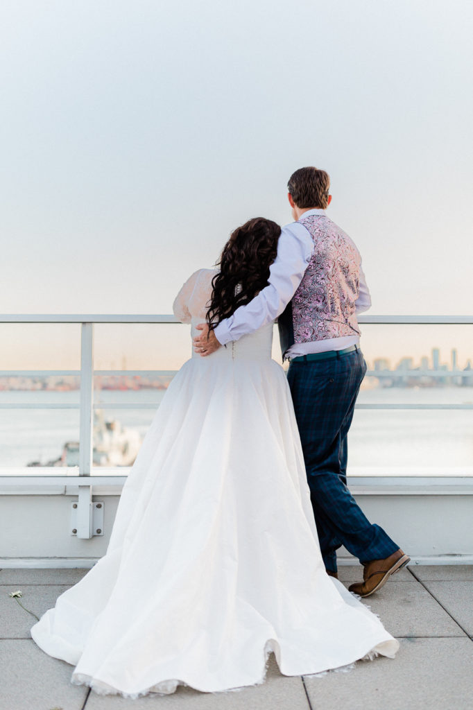 Choosing your wedding photographer.  Couple watching the sun set.